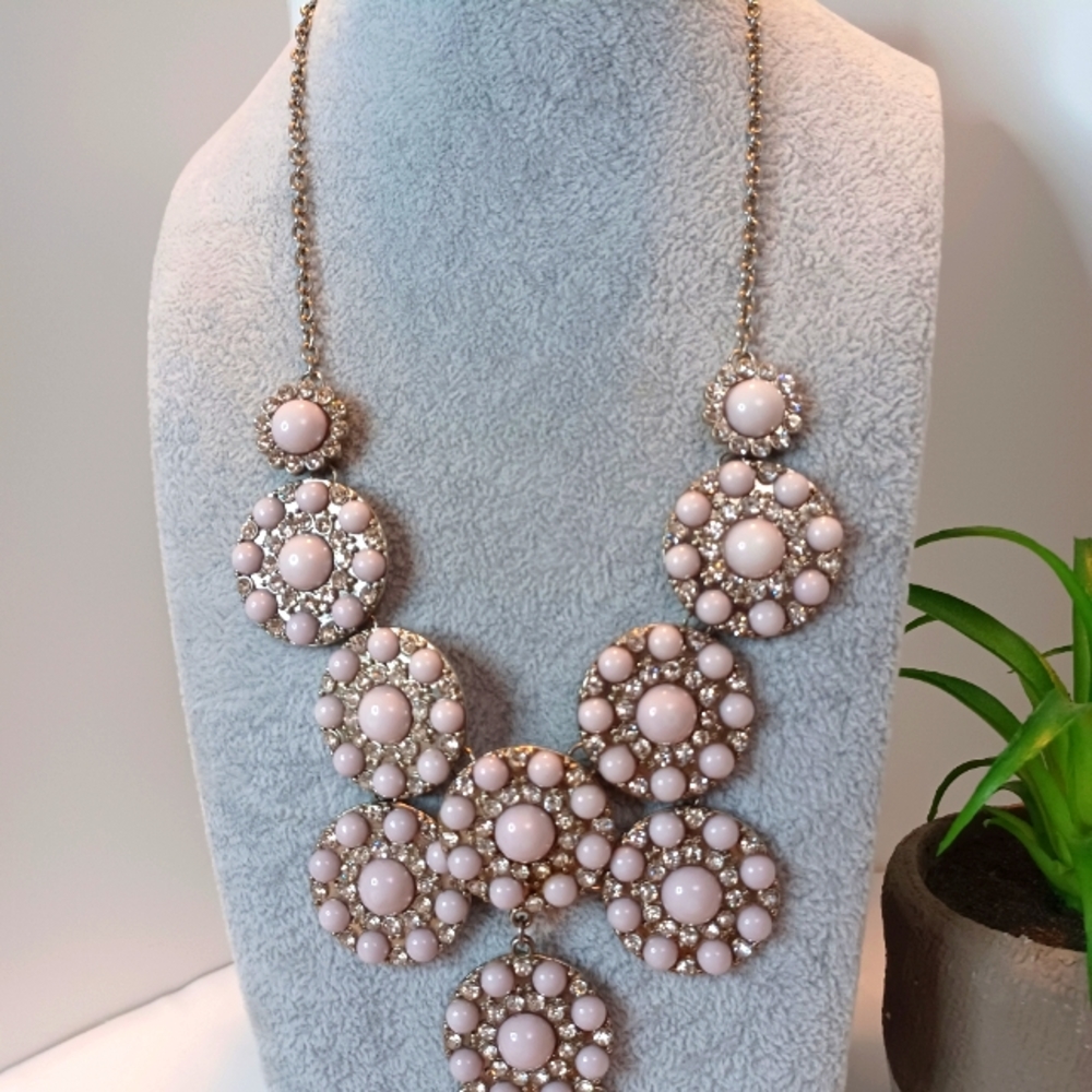Lavender colored necklace.